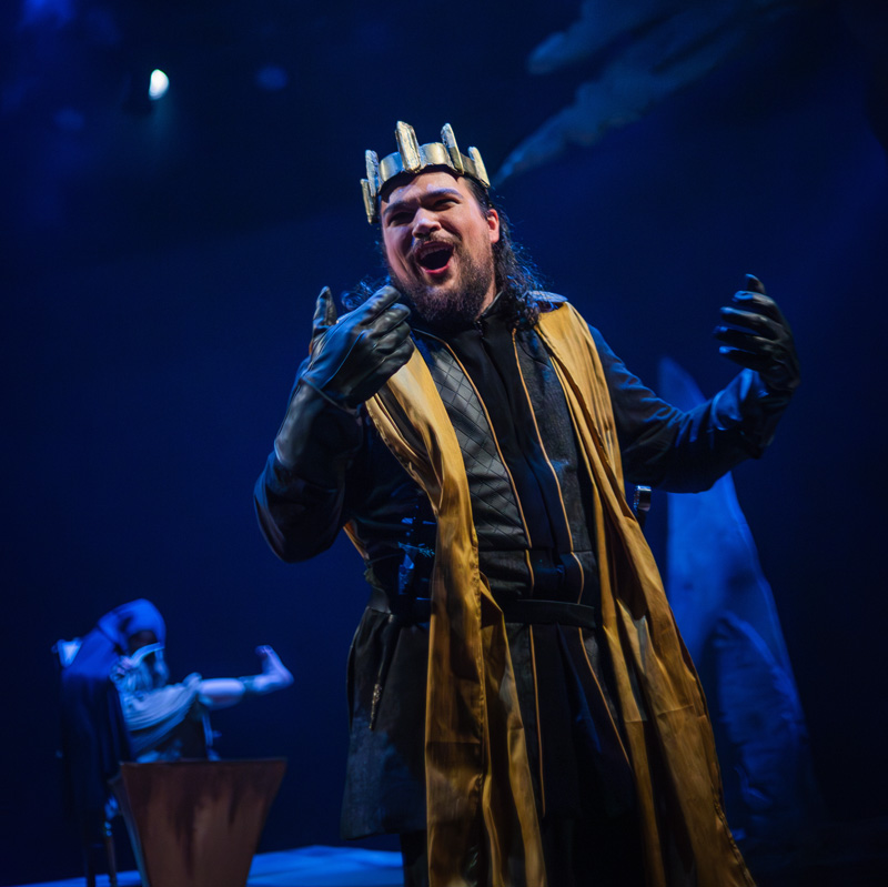 Student performs at the titular character of Macbeth on stage.