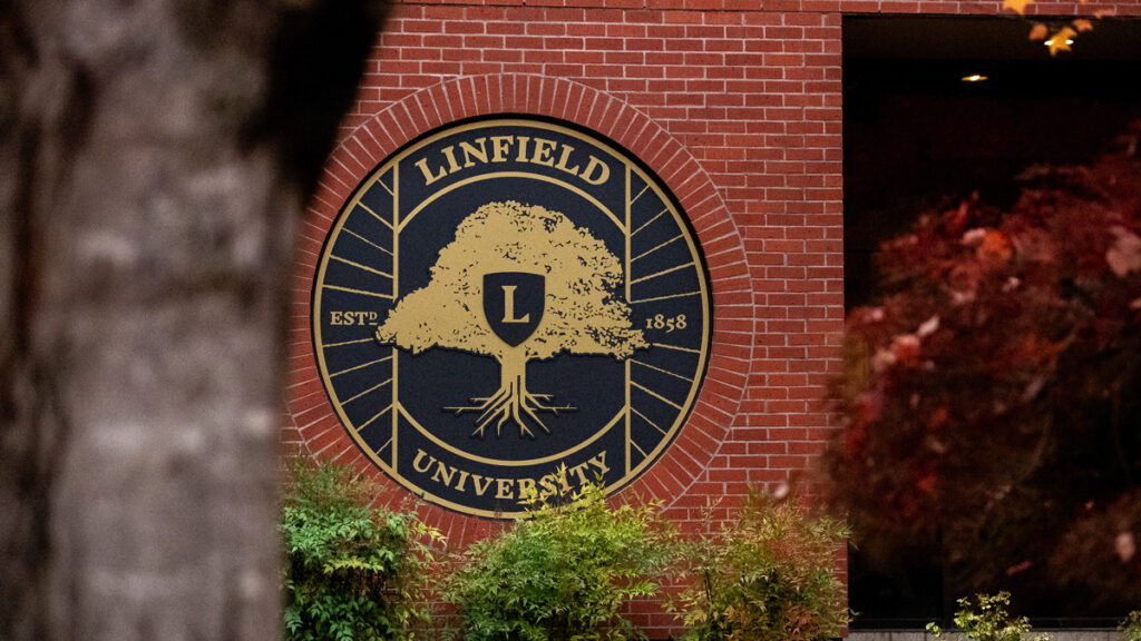 Linfield seal on a brick building