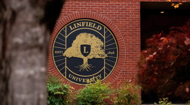 Linfield seal on a brick building