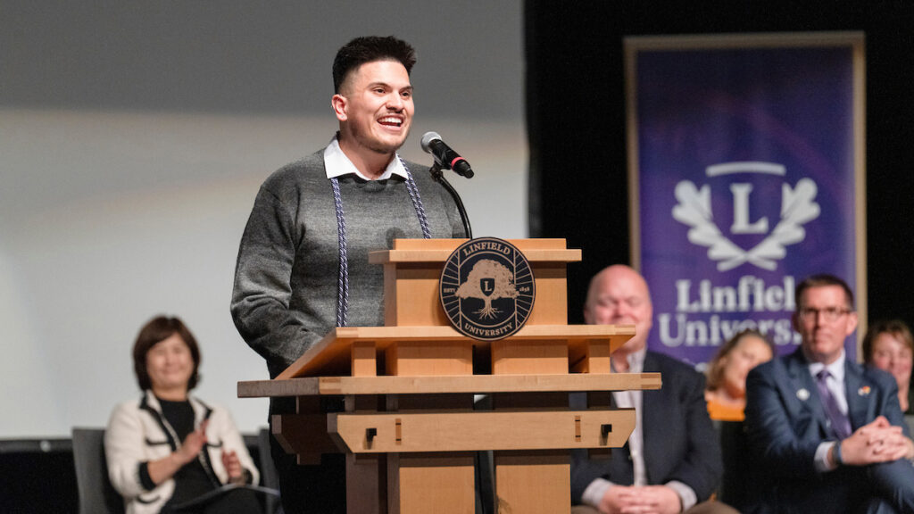 Student speaker Francisco Guevara speaks at podium