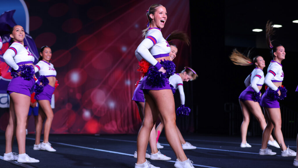 Members of the Linfield cheer team perform a routine at nationals