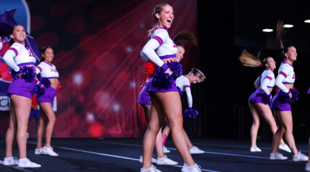 Members of the Linfield cheer team perform a routine at nationals