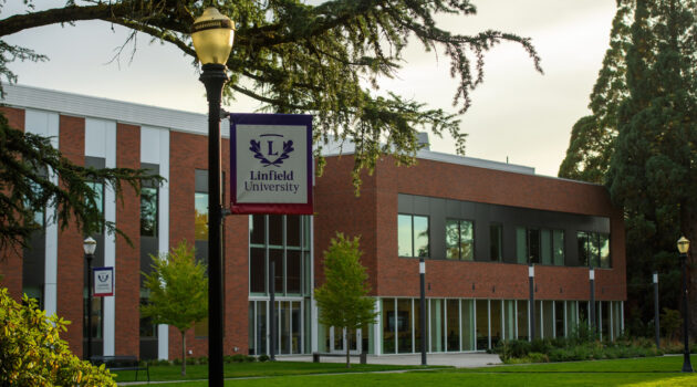 Linfield University banner on a lightpost in front of the Keck Science Center.
