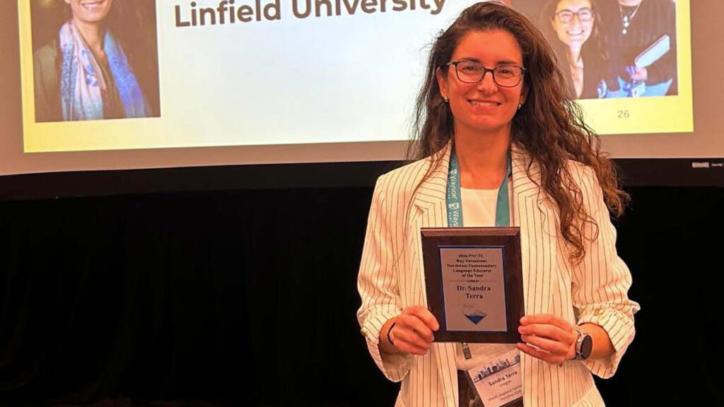 Sandra Terra poses with award
