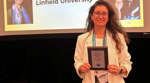 Sandra Terra poses with award