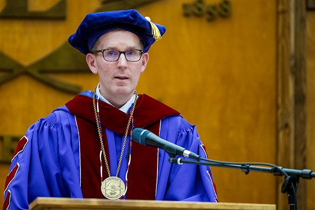 Mark Blegen speaking at the podium during his inauguration.