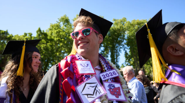 Graduate decked out in swag looks into crowd