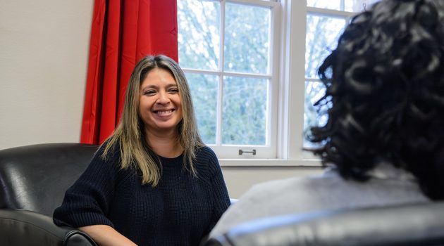Araceli Cruz interacts with a student at Linfield University.