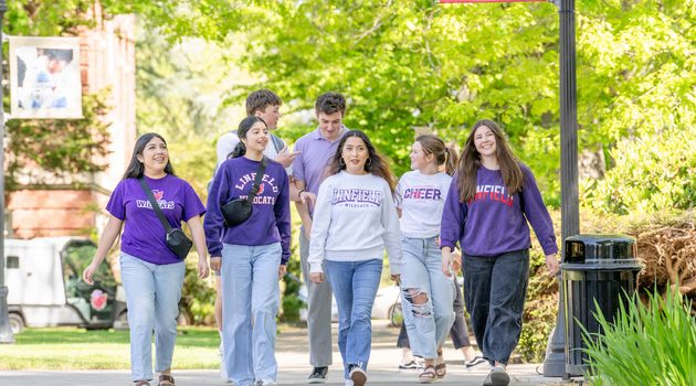 Linfield University students walk together at the McMinnville campus.